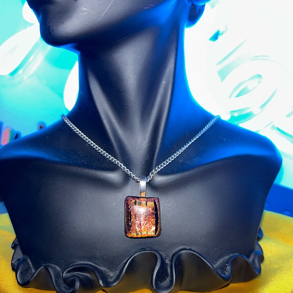 Iridescent peach bronze tones dichroic stone
